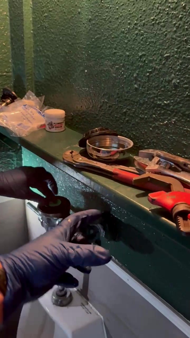 Plumbing tools and fixture repair in progress