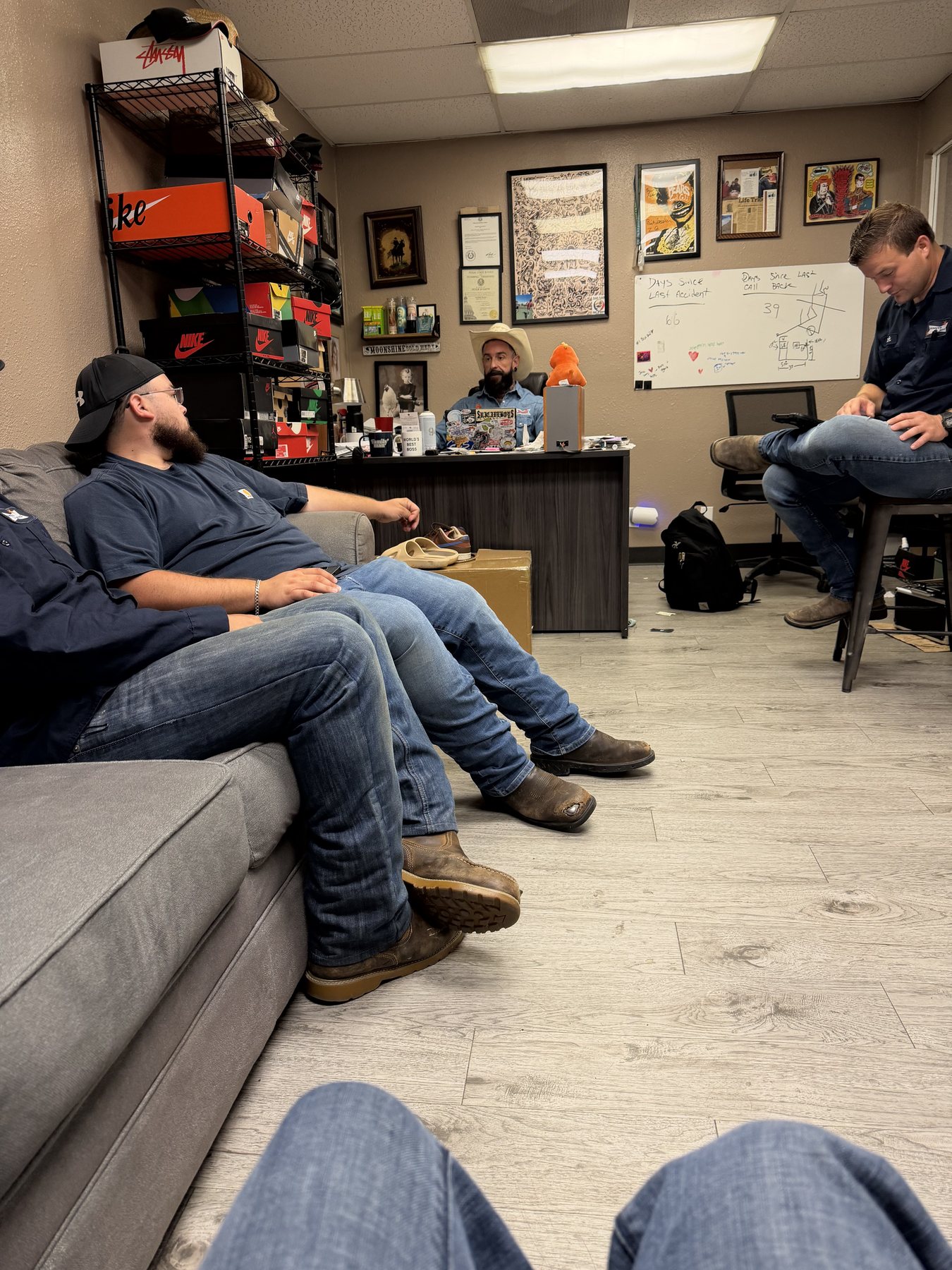 Smith & Sons Plumbing team meeting at the San Antonio office
